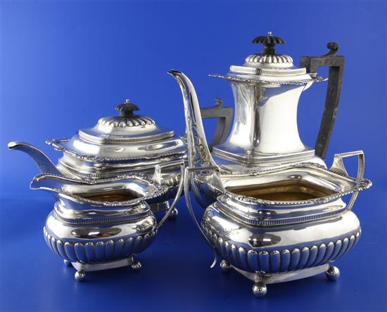 A late Victorian four piece demi-fluted silver oval tea and coffee service by Hunt & Roskell (late Storr & Mortimer), gross 63 oz.